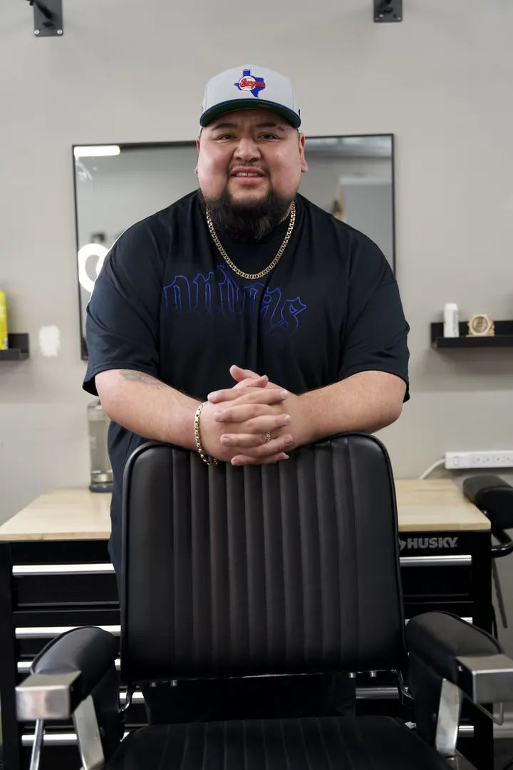 Alberto Lopez behind the chair